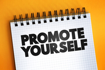 Promote Yourself text quote on notepad, concept background