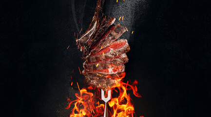 Wall Mural - grilled beef steak on a dark background. expensive marbled beef of the highest grade fried to rare on the grill