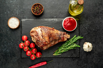 Leg of lamb baked in the oven on a stone background