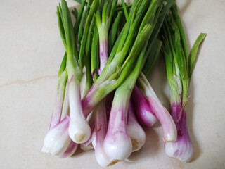 Fresh red onion with leaves - Stock photo