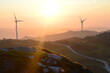 © Hugo - Wind Turbines and the sunset at the top of the mountain in Caramulo, Portugal