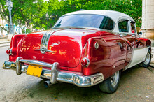 Rear View Of Red And White Vintage 1950's Pontiac Parked In Havana, Cuba.