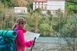 © carballo - woman with hiking map with backpack in nature
