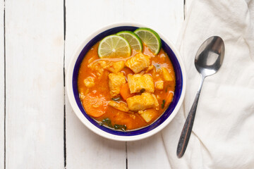 Sticker - Fish soup with vegetables on white background. Mexican food