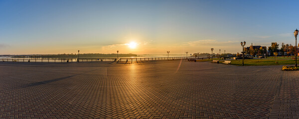 Wall Mural - Panorama of the rising sun on the embankment of the Kama River in Sarapul. Udmurt Republic, Russia.