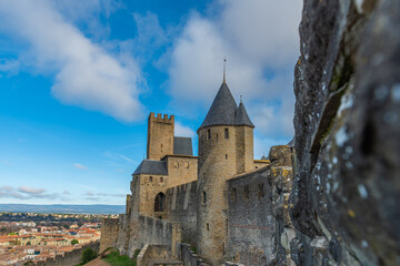 Wall Mural - View over the historical castle carcassone - cite de carcassone - with the towers, background blue sky, close up to the wall
