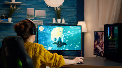 Canvas Print - Professional eSports gamer skilfully plays 3D shooter mock-up video game with super action and special effects on computer using headset. Cyber performing on powerful pc in stylish room