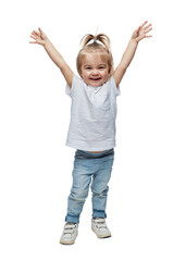 Wall Mural - Laughing little girl hands up. Kid 2 years old in jeans and a white T-shirt. Childhood, happiness and positivity. Full height. Isolated on white background. Vertical.