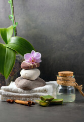 spa still life with towel, orchid and aloe