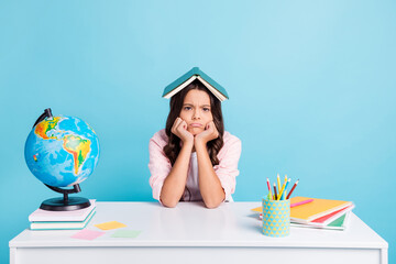 Canvas Print - Photo of young pretty unhappy upset stressed girl hold book one head tired studying isolated on blue color background