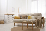 Fototapeta Panele - Stylish living room interior with comfortable sofa and small table