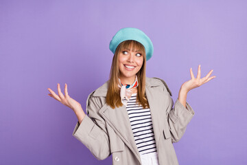 Sticker - Photo of dreamy adorable girl raise palms look up empty space wear blue beret coat isolated purple color background