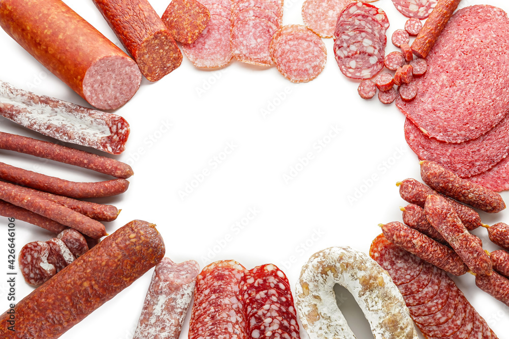 Frame made of different sausages on white background