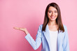 Photo of young beautiful happy smiling positive businesswoman hold hand demonstrate isolated on pink color background