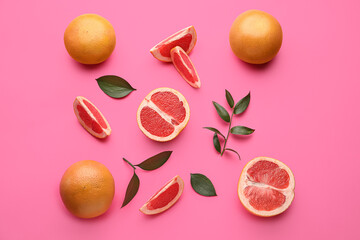 Fresh cut grapefruits on color background