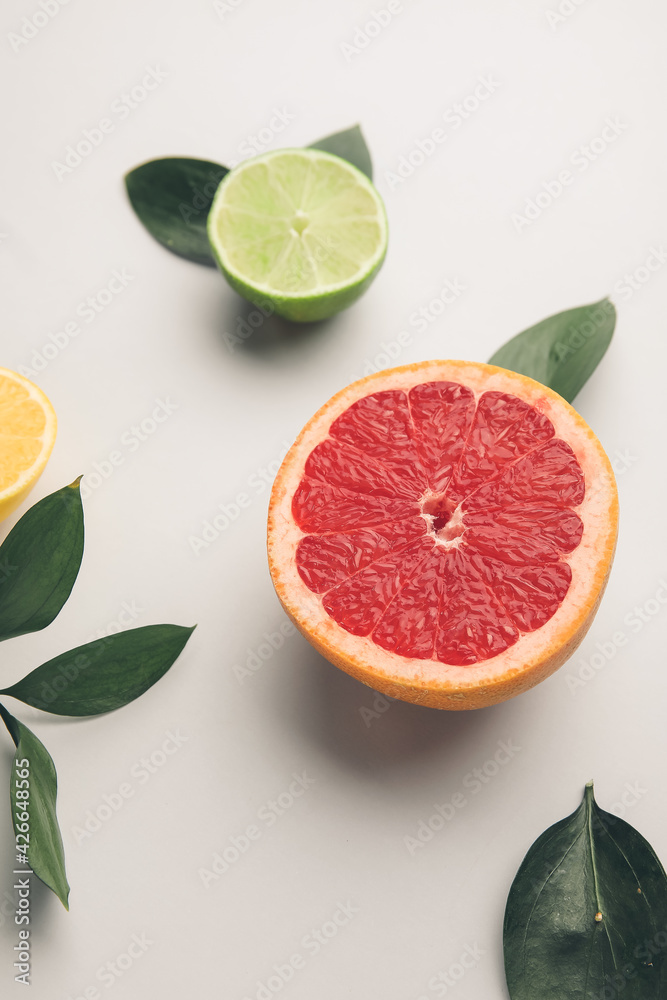 Fresh citrus fruits on white background