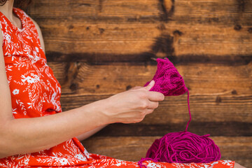 Wall Mural - Woman knits a hat