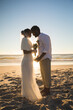 © Wavebreak Media - African american couple in love getting married on beach touching foreheads