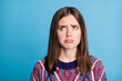 © deagreez - Photo of young girl happy unhappy sad upset moody look empty space isolated over blue color background