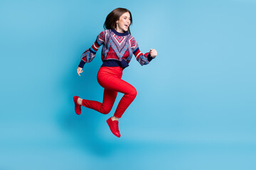 Sticker - Full length body size view of attractive cheerful girl jumping running active life isolated over bright blue color background