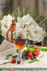 Wall Mural - fresh Berry lemonade in wine glass on the table