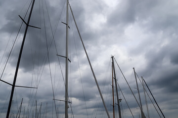 Canvas Print - Low angle shot of the electric pole power lines and wires on the cloudy sky background