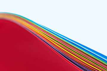 Wall Mural - Edges of a bundle of color paper sheets abstract macro shot