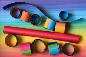 Wall Mural - Rolled color paper sheet and paper strips on colorful background