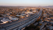 Sunset Aerial View Of The 101 Freeway And A Residential Area Of Oxnard, California, USA.