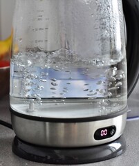 boiling water in a glass teapot