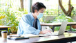 © mangpor2004 - Young asian campus student man wearing protection mask working with laptop computer while online study in campus, coronavirus prevention in university, social distancing, online learning