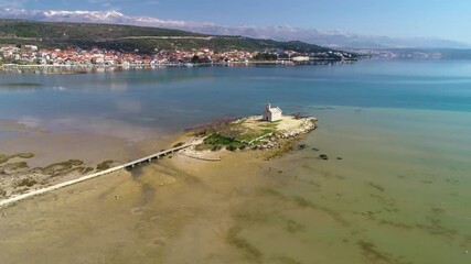 Wall Mural - Coastal town of Posedarje and small island church aerial view, Dalmatia region of Croatia