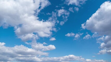 Wall Mural - 4k time lapse stock video footage of beautiful sunny clear blue sky with many moving along fluffy wh