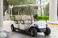 White Golf Cart Of The Hotel  .Travel Service  Concept .