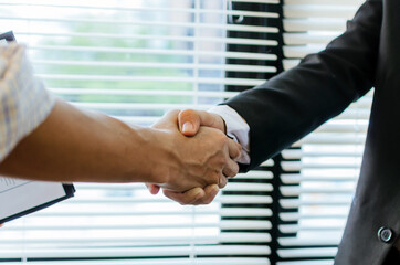 Wall Mural - Partnership. two business people investor handshake deal with partner after finishing up business meeting in meeting room office, financial, teamwork, job interview, contract agreement concept
