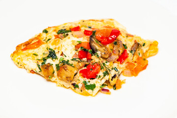 A hearty vegetarian omelet with vegetables on a white background.