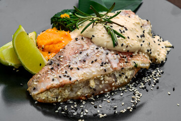 Wall Mural - Grilled sea bass with white sauce and lemon