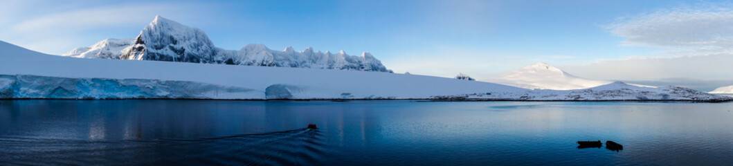 Wall Mural - Snow covered Mountains and Icebergs in the Antarctic Peninsula on Antarctica.