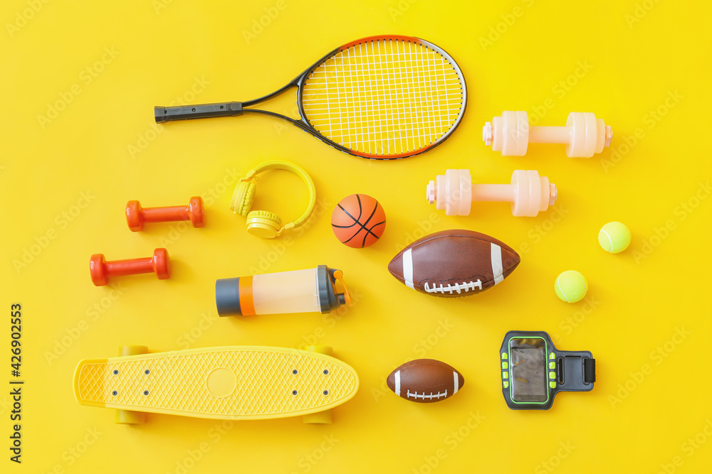 Set of sport equipment on color background