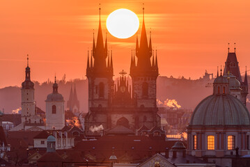 Wall Mural - The sun sets up in between towers of the Church of Our Lady before Týn in Prague.