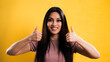 © 4kclips - Young pretty woman makes thumb-up gesture - studio photography