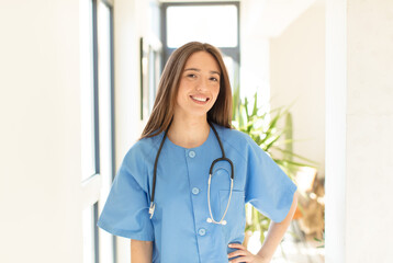 Sticker - pretty nurse smiling happily with a hand on hip and confident, positive, proud and friendly attitude