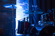 Drum set and cymbal on a stage in blue light