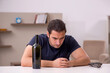 © Elnur - Young male alcoholic committing suicide at home