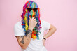 © zzzdim - Hilarious looking man in a wig over face and sunglasses stroking beard.