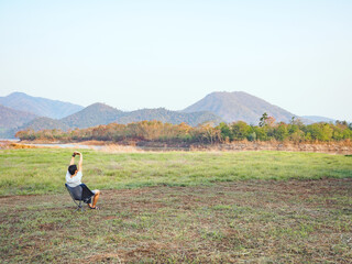 Solo traveler enjoying to beautiful landscape mountain lake.