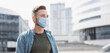 © kite_rin - Man wearing protective face mask in a city, Masked caucasian man on a city street closeup portrait, Epidemic, pandemic, corona virus protection, healthy lifestyle, self-care, people concept