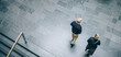© Jacob Lund - Business colleagues walking in office hallway