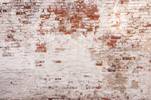 Abstract Red White Stonewall Urban Texture. Old Red Brick Wall With Shabby Damaged White Plaster. Painted Whitewashed Brickwall Grungy Background. Stonework Frame Grunge Empty Wallpaper.