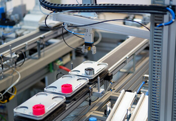industry 4.0 smart factory concept; artificial intelligence in production. gripper picks up the prod